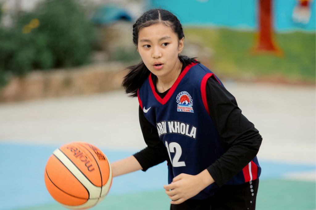 Girl playing basketball